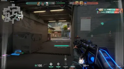 Valorant practice range with a gaming mouse and sensitivity settings displayed.